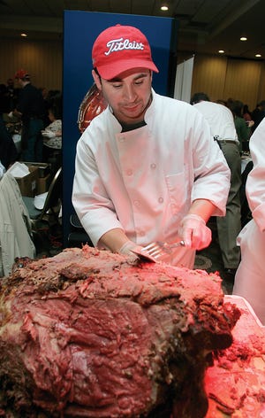 Executive Chef Victor Duran of the Segreganset Country Club slices some roast beef at the annual Taste of Taunton event held at the Holiday Inn.