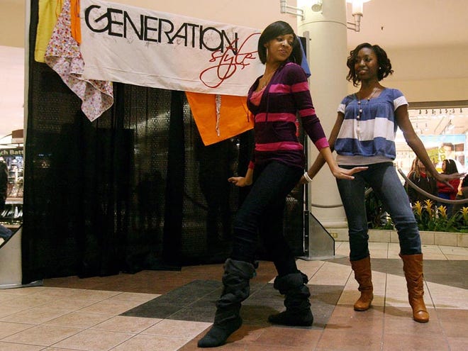 Shalitha McLean, left, and Jamie Rogers, students at Northridge High School, practice their modeling routine inside University Mall on Thursday for the upcoming “Generation Style” fashion show presented by University Mall’s Junior and Teen Teams.