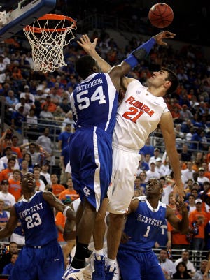 Florida's Dan Werner is blocked by Kentucky's Patrick Patterson in the first half at the Stephen C. O' Connell Center in Gainesville Saturday, March 7, 2009.