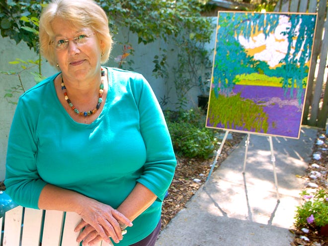 Susan Klein, with one of her acrylic paintings of Myakka River State Park, is one of the artists participating in the Creators & Collectors Tour.