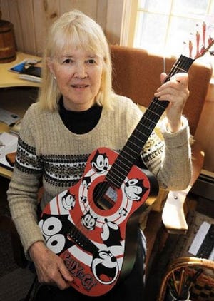 Bea Scribner is still working out the tune for “Got Housing?” on her Martin guitar, but she may end up going a cappella.
