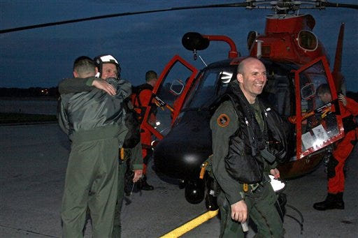 This image provided by the U.S. Marine Corps shows Lt. Col. Joseph Maybach, the commanding officer of Marine All Weather Fighter Attack Squadron 224, back to camera, giving a welcome-back hug to one of the two aviators recovered Wednesday evening March 10, 2010 off the coast of South Carolina. The two Marine Corps fighter pilots were rescued from the ocean off South Carolina after their aircraft went down about 35 miles off the coast. (AP Photo/US Marine Corps, Sgt. Angel Galvan )