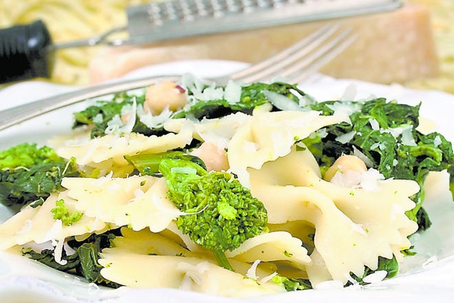 A hearty pasta dish is often the best route to satisfying a dinner table with both vegetarians and meat eaters. This bow-tie pasta with rapini and chickpeas has all the right ingredients including chickpeas that have a firm, meaty texture. By LARRY CROWE, AP photo