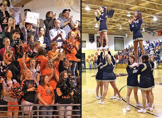 Rudyard fans (top left) in their orange and black rooted on the Bulldogs in the varsity boys District Championship basketball game at St. Ignace Wednesday evening. They were opposed by the St. Ignace cheerleaders (top right), who were shouting encouragement for the Saints.