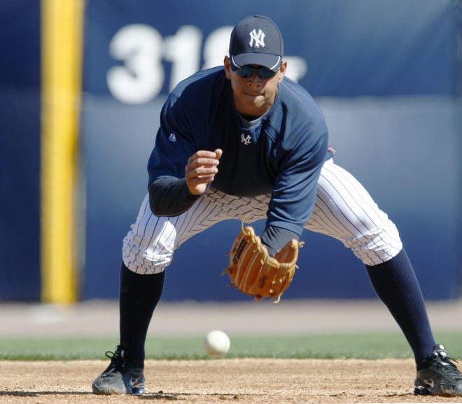 New York Yankees third baseman Alex Rodriguez fields balls before the Yankees faced the Toronto Blue Jays in a spring training baseball game at Steinbrenner Field in Tampa, Fla., Saturday, March 6, 2010.