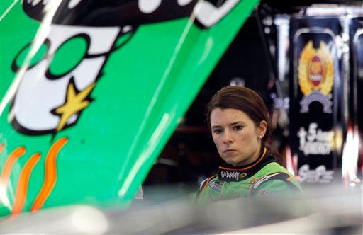 In this photo taken on Feb. 10, 2010, driver Danica Patrick looks on in the garage during a practice session at the NASCAR Nationwide Series auto race in Daytona Beach, Fla. In preparation for her NASCAR debut, Danica Patrick watched replays of past races and sought advice from other drivers. It helped her make a good first impression this week, earning respect from many who were wary she wouldn't be able to make a smooth transition from IndyCar. (AP Photo by J Pat Carter)