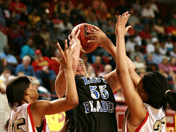 East Bladen’s CJ Melvin (55) tries to put up a shot after pulling in a rebound Saturday during the Eagles’ loss in the 2A state championship game in Raleigh. Melvin finished with 17 points and 12 rebounds and was named Most Outstanding Player for the East.