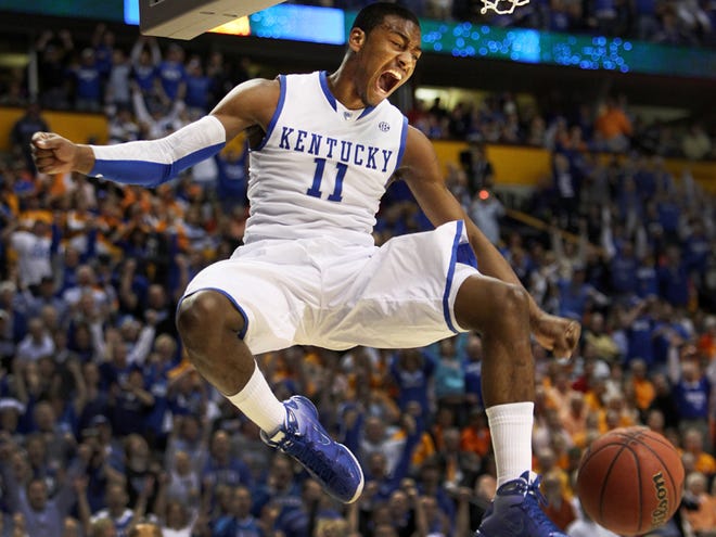 Kentucky's John Wall dunks the ball against Tennessee during the first half of the semi-finals of the SEC Tournament at the Bridgestone Arena in Nashville Friday, March 12, 2010.