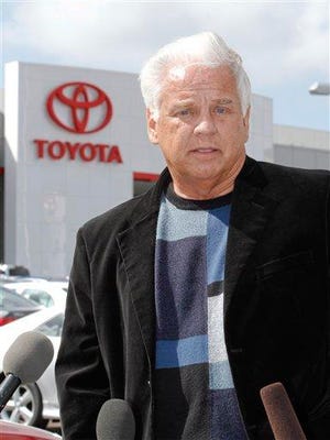 In this Tuesday, March 9, 2010 file photo, driver James Sikes talks about his experiences in his Toyota Prius during a news conference held at Toyota of El Cajon in El Cajon, Calif. A law firm for the driver who says his Toyota Prius sped out of control in California doesn't plan to sue the Japanese automaker.