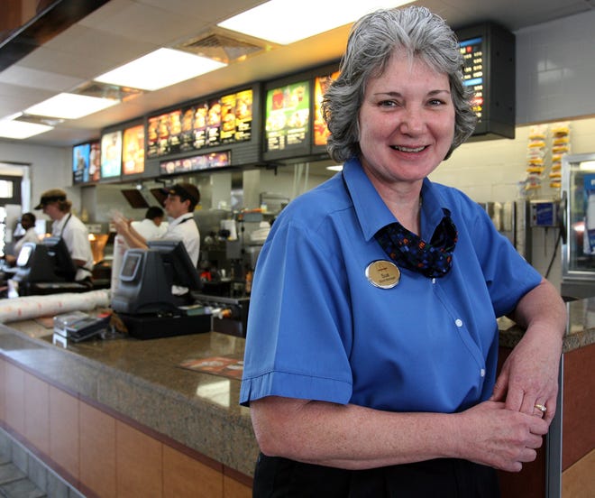 Sue Lawson, a McDonald's manager, poses for a photo at the McDonald's on East Silver Springs Boulevard in Ocala. Lawson received the Ray Kroc Award for 2009 for being one of the best 126 McDonald's managers in the entire United States.