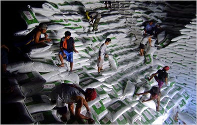 Workers loaded sugar for delivery last month at Hacienda Luisita, a Philippine plantation that is owned by the family of former President Corazon C. Aquino.