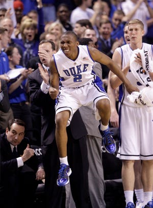 Duke's Nolan Smith (2) reacts to play during the first half of an NCAA college basketball game against Georgia Tech in the Atlantic Coast Conference tournament in Greensboro, N.C., Sunday, March 14, 2010. Duke coach Mike Krzyzewski, lower left, looks on. (AP Photo/Chuck Burton)