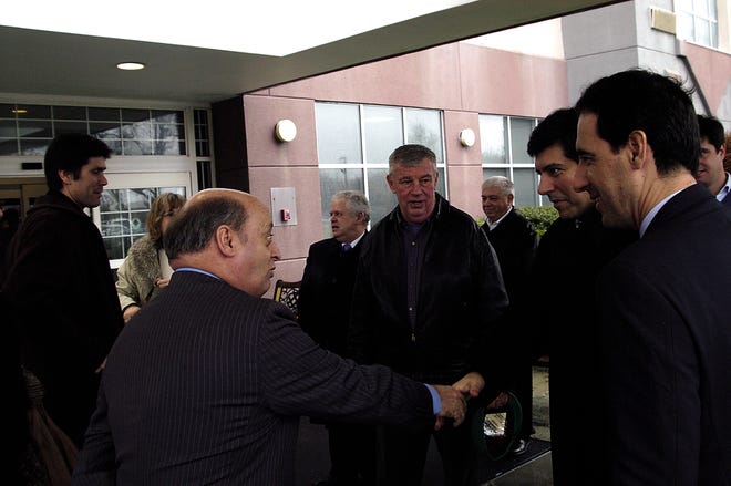 Mayor Charles Crowley, left, greets a member of the Portuguese business delegation on Sunday. Looking on is state Rep. James Fagan, D-Taunton.