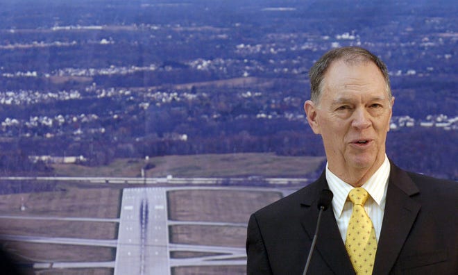 FAA Administrator Randy Babbitt speaks during a ceremony to celebrate the presentation of a $16.625 million check to Akron-Canton Airport officials to complete the runway 5/23 safety upgrade and extension project.