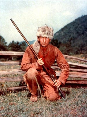 In this undated image released by Disney, Fess Parker is shown Davy Crockett in Disney's, "Davy Crockett." Family spokeswoman Sao Anash says Parker died Thursday, March 18, 2010, of natural causes at his Santa Ynez home near the Fess Parker Winery. He was 85.