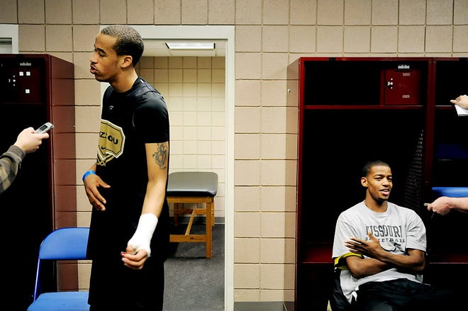Missouri’s Laurence Bowers, left, and Kim English answer questions in the locker room before practice yesterday at the HSBC Arena in Buffalo, N.Y. Bowers is still wearing a splint to protect two torn ligaments in his left wrist.