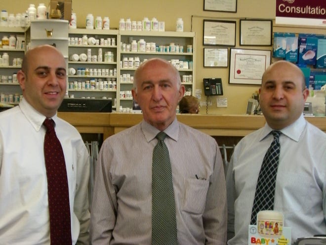 Ramzi Dinno, center, with his sons Ray, left, and Saad, all of Weston,operate three community pharmacies in Auburndale, Acton and West Concord.