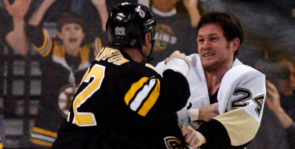Boston's Shawn Thornton (22) comes to blows with Pittsburgh's Matt Cooke early in Thursday night's first period. Cooke was targeted for his March 7 hit to head of Boston’s Marc Savard.