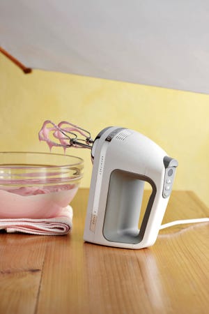 This image product released by Williams-Sonoma, shows Kitchenaid Architect 9-speed haand mixer with digital controls, swivel cord and sensor that maintains speed.