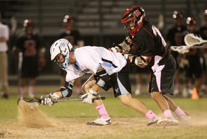 LYNN DAMM/For ShorelinesPonte Vedra High lacrosse player Michael Power (right) had five goals and two assists in Wednesday night's game against Flagler Palm Coast. Ponte Vedra won 15-2. The Sharks remain undefeated with a record of 13-0