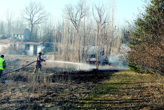Berlin-Orange firefighters combat an out-of-control brush fire on West Tuttle Road. Fires like these are preventable by following recommended guidelines for burning leaves and yard refuse.