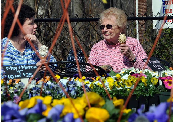 Pat Hedderig of Hudson, right, and her daughter Pam enjoy the first day of spring eating ice cream at Trombetta's Farm in Marlborough Saturday. Trombetta's was crowded with people taking advantage of the warm weather and the farm's homemade ice cream.