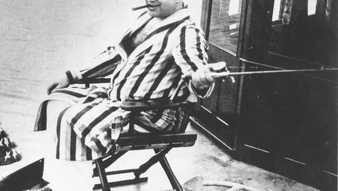 Al Capone fishes off Palm Island. Capone's home in Miami was his alibi for the 1929 St. Valentine's Day Massacre.