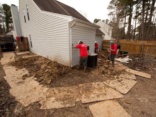 The soil under the home of Psonya Wilson in Brandon, Miss., has required some major work and repairs in February 2010. Extreme weather events associated with climate change have provoked unprecedented foundation failures in houses nationwide. Foundation repair companies report a doubling and tripling of their business in the last two decades with no let-up even during the recession.