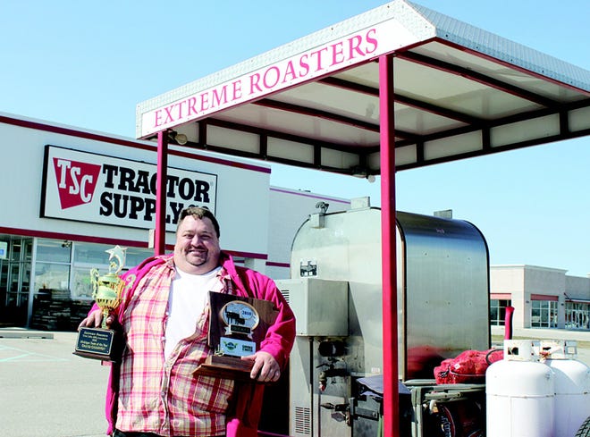 Extreme Roasters Troy Conner is shown with his 2009 Great Lakes Barbecue Association grand champion trophy and his Smoke on the Water USA Barbecue Championship Brisket Trophy that he received March 20. Starting April 10, Extreme Roasters will be selling barbecue in the parking lot of Tractor Supply Co. in Ionia.