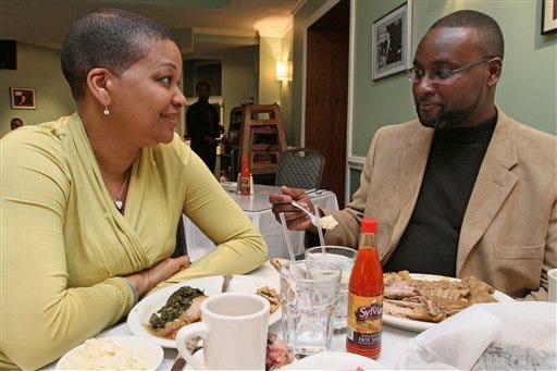Joan Griffith-Lee, left, and her husband Don Lee have dinner Thursday March 25, 2010 at a restaurant in New York. The couple, who live in the Staten Island borough of New York, have been married for 20 years.