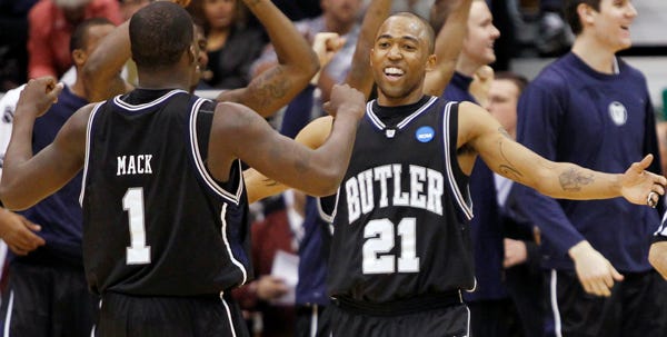 Butler's Shelvin Mack, left, and Willie Veasley celebrate after the Bulldogs beat top-seeded Syracuse in the West Regional semifinals on Thursday night.