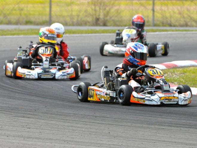 Drivers in the Rotax mini max division race around one of the many sharp curves on the track during a race Saturday March 20, at the Ocala Gran Prix track in Ocala, Fla.