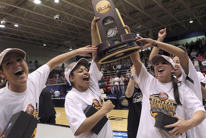 Emporia State celebrates winning the NCAA Division II women's basketball championship game Friday in St. Joseph, Mo. The Hornets beat Fort Lewis 65-53.
