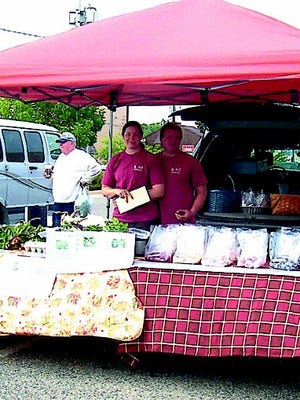 Monica and Scott Wendt sell heirloom vegetable produce from their farm last summer during the Cheboygan farm market. This year, they are offering a CSA produce share option as well as selling their products at markets.