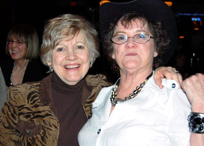 Marilyn Parker, left, shares a genial moment with the real Elaine Pate.