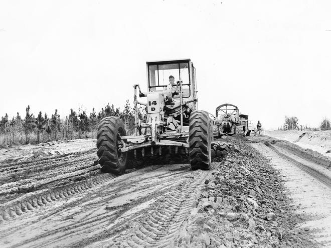 Heavy road machinery prepares the base for a section of Baseline Road east of Ocala that was being paved in March 1963.