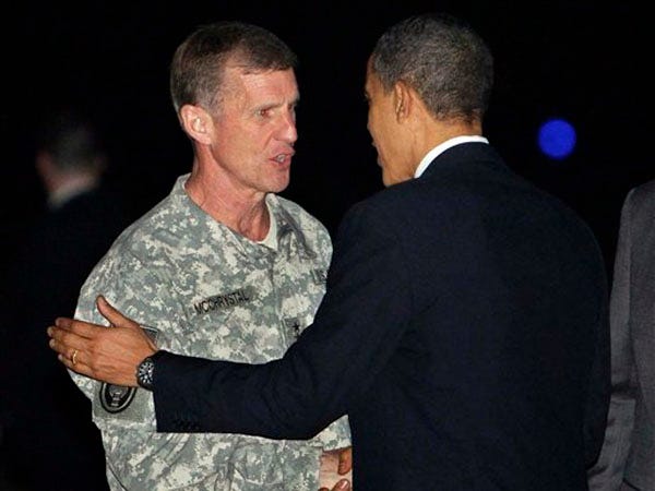 President Barack Obama is greeted by Commander of U.S. and NATO forces in Afghanistan Gen. Stanley McChrystal, left, at Bagram Air Base, Afghanistan, en route to an unannounced visit with Afghan President Hamid Karzai in Kabul Sunday.