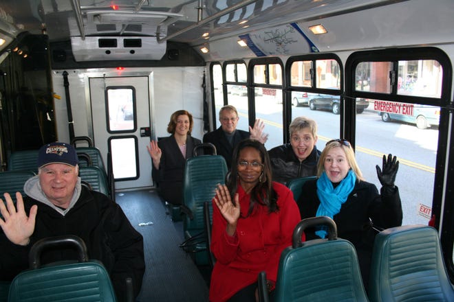 Marlborough residents and officials celebrated the launch of the MetroWest Regional Transit Authority's Saturday service yesterday in the city. Clockwise from left are resident Peter Werner, mayoral aide Krista Holmi, Mayor's Transportation Task Force Chairman Walter Bonin, Employment Options Inc. Executive Director Toni Wolf, state Rep. Danielle Gregoire and Marlborough Health and Human Services Director Rosalind Baker.