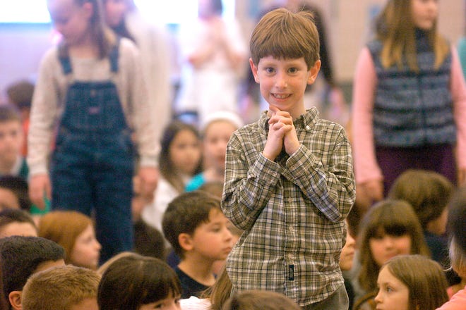 First grader Cory Sample is thrilled as his name is called showing he is respectful to his peers during a school-wide assembly on the topic of showing RESPECT to others March 26, 2010 at Woodville Elementary. Respect is part of the school anti-bullying program.