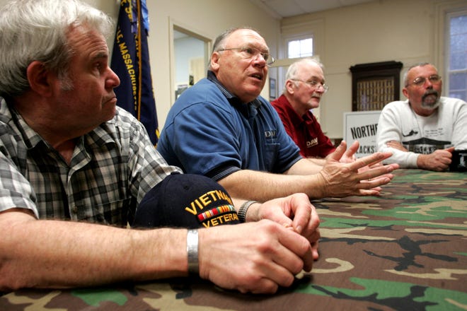 Bill Audette, second from left, veterans agent for Northbridge, is a part of the new Northbridge Vietnam Memorial Committee. During a press conference at 
Northbridge Veterans Hall yesterday, he discussed the plans 
for the new memorial which will include an area in honor of Sgt. Joseph E. Fitzgerald, the one soldier from Northbridge who was killed in Vietnam in 1967. Fellow committee members Tom Farley, left, Gregory Gentzler, second from right, and Carl Boudreau, right, who all are Vietnam vets, are also part of the committee.