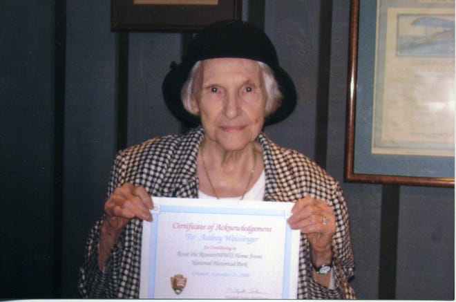 Audrey Weissinger, Kirkwood, shows her certificate for contributing to the Rosie the Riveter World War II Home Front National Historical Park.