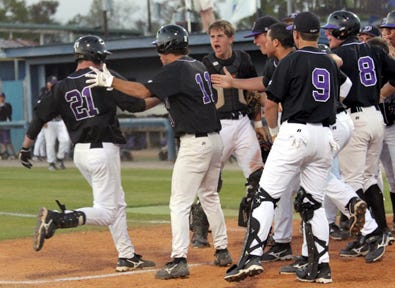 Dutchtown's Britt Gautreaux crosses home plate surrounded by his Griffin teammates after hitting a grand slam against East Ascension Thursday night.