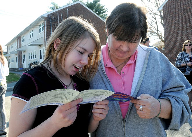 Hayley Allen, 15, left, and her mother, Sharon, look over the different bus routes on a new map of kid-friendly routes introduces yesterday by the MetroWest Regional Transit Authority in Framingham.