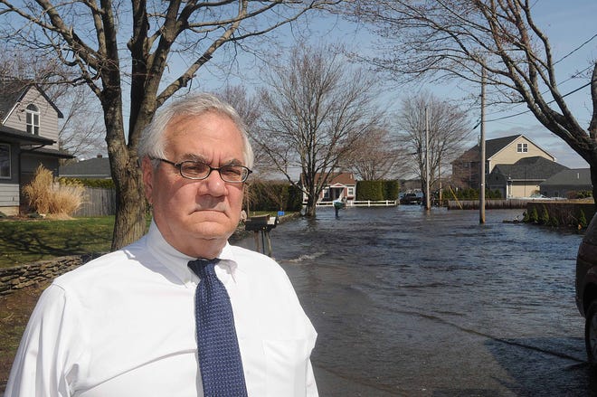 Barney Frank standing just outside the flooded area of Heaven Heights in Freetown.
