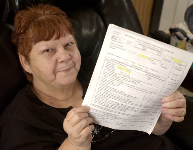 Drexie Conley holds papers bearing her signature for a house she recently purchased from the brother of a man who's been missing for a year. Conley said she never signed the paper, and that the signature is not hers. On Jan. 7, she bought a Bank Place SW home that had been the last known residence of Raymond Staats. Staats' family says he's dead although Canton police list him as a wanted fugitive and Stark County sheriff's deputies say he's the subject of a missing person case. Conley also questions how Staats' brother, Gary Staats, obtained ownership of the house he sold her.