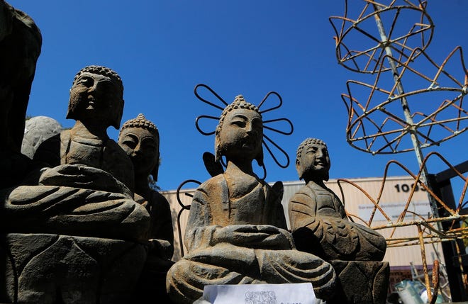 Stone Buddhas greet visitors to Sarasota Architectural Salvage on Central 
Avenue. STAFF PHOTOS / DAN WAGNER