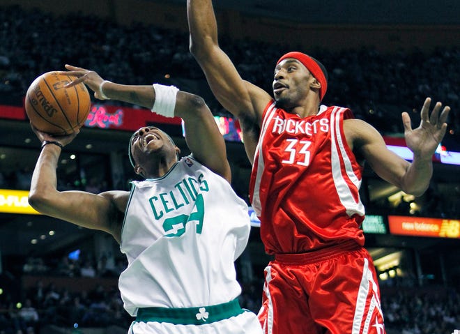 The Rockets' Mike Harris fouls Celtics forward Paul Pierce in the second quarter of Friday's game in Boston.