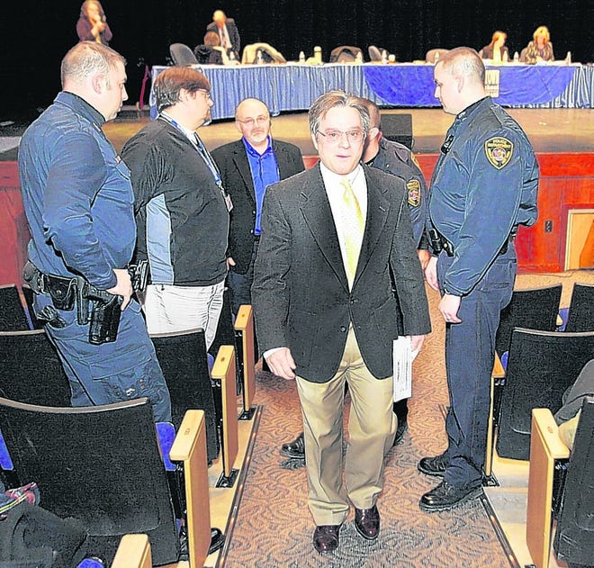 Fran Hoefer is seen being escorted from the March 3 Middletown school board meeting. On Thursday, he was more subdued.