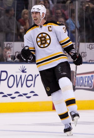 Bruins defensemen Zdeno Chara celebrates after his shot was tipped in to give Boston the overtime win last Saturday.