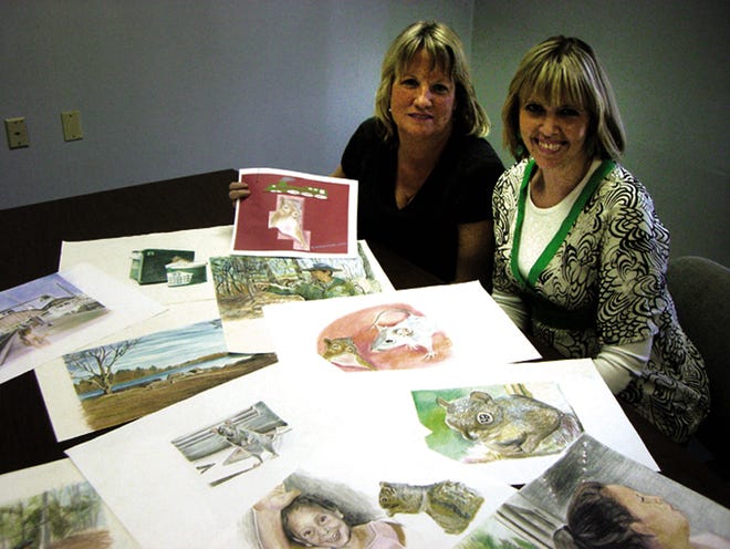 East Bridgewater mothers Julie DeRoo and Laura Balboni-Craciun display colorful pastel illustrations that will appear in their upcoming children's books, which are currently in the works.